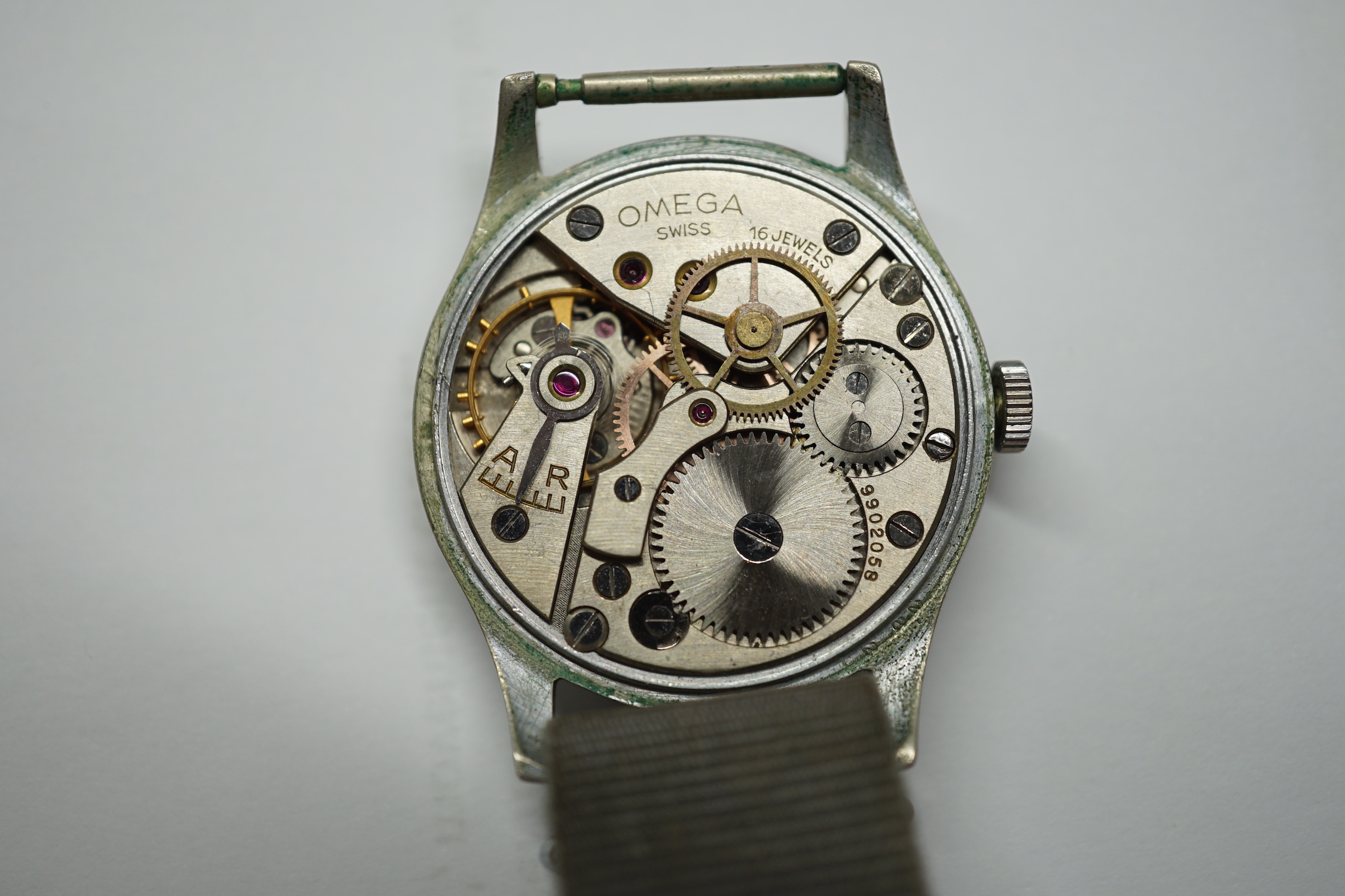 A gentleman's early 1940's stainless steel military issue Omega manual wind wrist watch, on fabric strap, the case back inscribed 'HS arrow 8 over 3282', movement c.30T2.